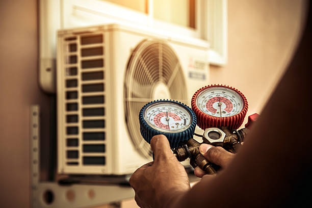 Professional Air Conditioning Service technician working in Wakarusa, IN